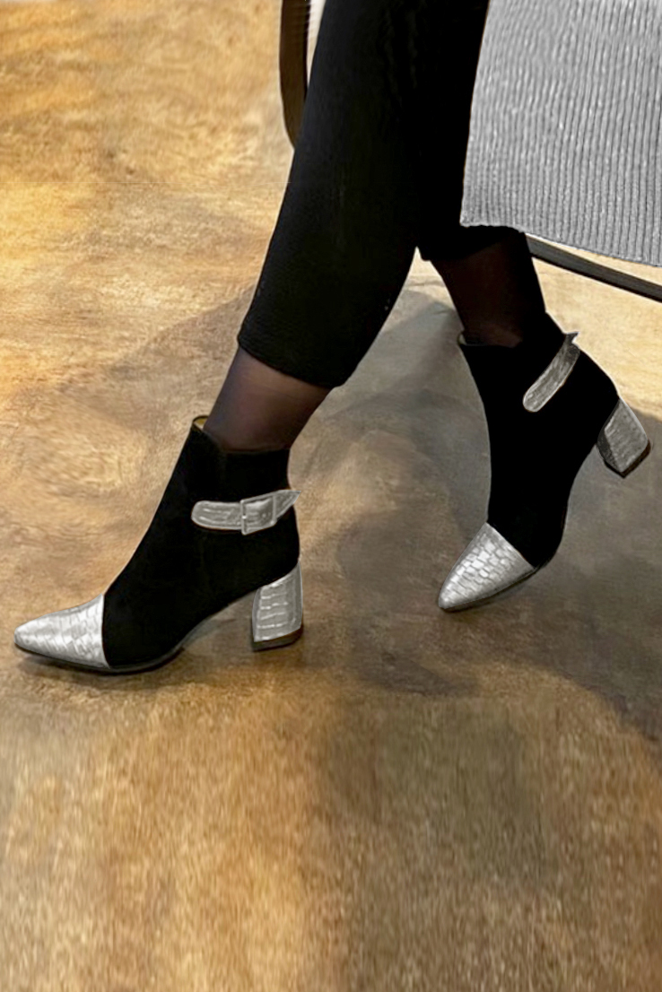 Light silver and matt black women's ankle boots with buckles at the back. Tapered toe. Medium flare heels. Worn view - Florence KOOIJMAN